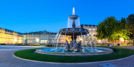 Schlossplatz with fountain and New Palace travelling panorama blue hour in Stuttgart