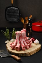 Raw fresh lamb crown roast on the kitchen table