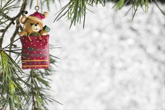 Christmas toy hanging on fir tree