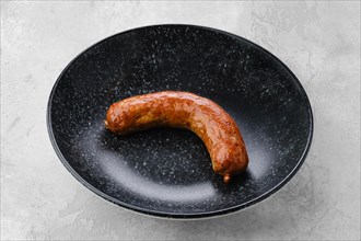 Fried bavarian sausage on a plate