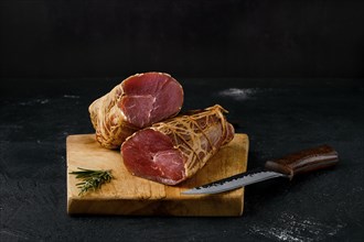 Smoked beef fillet meat on cutting board