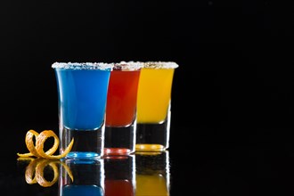 Three shot glasses with cocktails coy space. Resolution and high quality beautiful photo