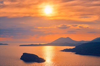 Aegean Sea with Greek islands view on sunset. Cape Sounion