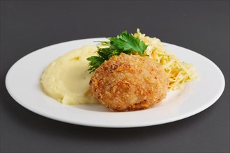 Chicken Kiev cutlet with mashed potato on a palte