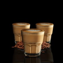 Three glasses of Cappuccino isolated on black