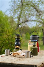 Making coffee or tea on portable gas stove on the nature. Travel