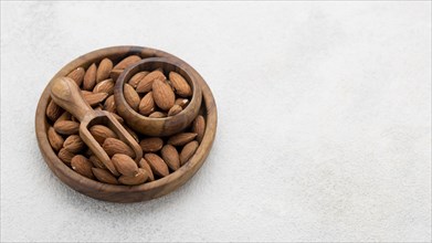 Organic almond nuts bowl copy space