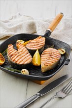 Grilled trout steaks on pan
