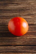 Fresh tomato on wooden table