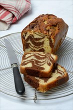 Marble cake and knife on cake rack