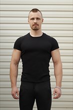 Portrait of strong man in black t-shirt