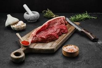 Raw beef ribeye lip on with skin on wooden cutting board
