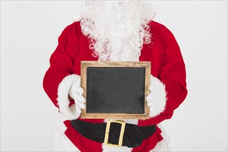 Santa claus showing empty wooden frame. Resolution and high quality beautiful photo