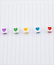 Love cubes and paper arrow on a notebook