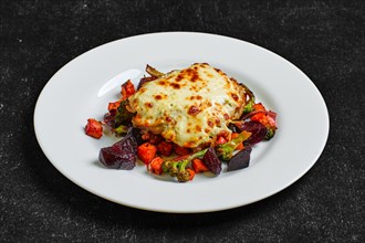 Cod fillet baked with cheese topping served with fried beet