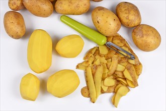 Top view of food preparation with peeled potatoes