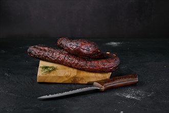 Smoked beef sausage on cutting board