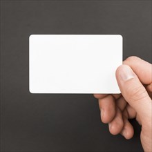 Hand holding business card
