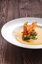 Mashed pumpkin soup puree with bacon