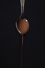 Close up spoon with tasty chocolate mousse