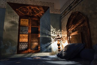 Atmospherically lit bedroom in a riad