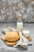 Healthy breakfast with fresh homemade yeast-free bread and milk