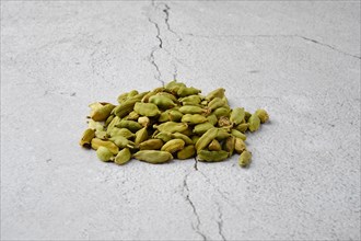 Pile of cardamom on abstract background