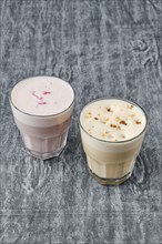 Two glasses with raf coffee in shabby grey background
