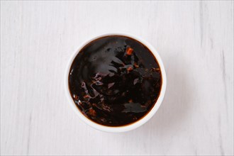Overhead view of small bowl with spicy teriyaki sauce