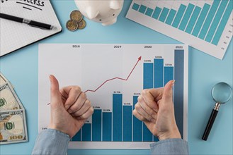 Top view business items with growth chart hands giving thumbs up. Resolution and high quality beautiful photo