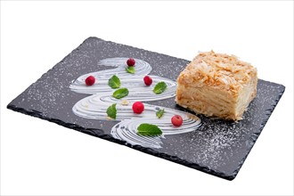Napoleon cake on plate isolated on white background