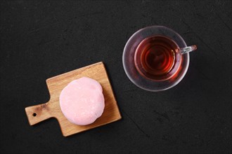 Top view of sweet dessert mochi with strawberry with fruit tea