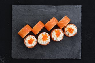 Rolls with salmon and cream cheese with caviar