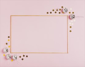 Cute frame with christmas balls pink background