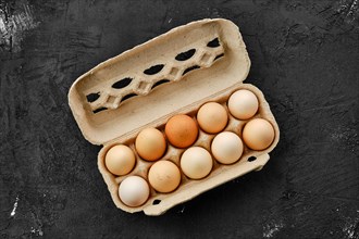 Fresh country eggs in cardboard packaging
