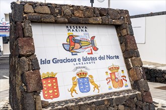 Isla Graciosa e Islotes del Norte sign informing about Nature Marine Reserve including Graciosa Island and small northern islands next to Lanzarote
