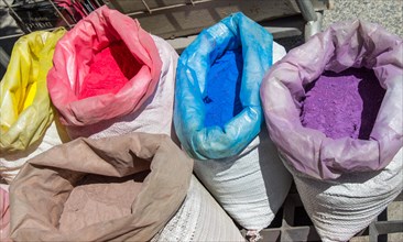 Sacks with paint pigment in different colors for sale