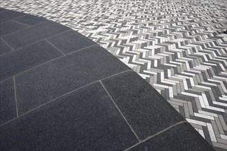 Creative structure with paving stones on sidewalk