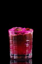Espresso and tonic with pitaya syrup on black background
