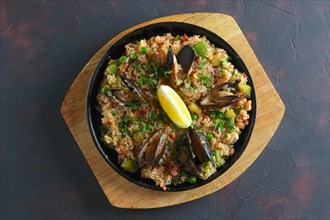 Top view of traditional spanish paela with shrimps and mussels