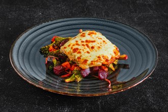 Cod fillet baked with cheese topping served with fried beet
