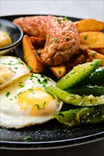 Closeup view of fried eggs with sausage