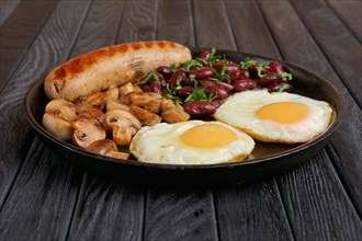 Cast-iron frying pan with fried eggs