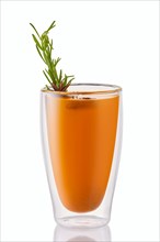 Hot sea buckthorn winter drink with rosemary isolated on white