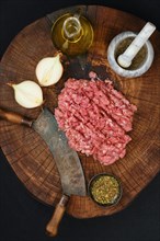 Making fresh raw beef mince meat with chopping knife