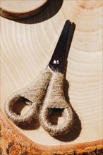 Metal scissors with wool handle in the view