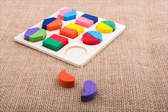 Colorful wooden pieces of a logic puzzle
