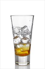 Highball glass with ice and whiskey isolated on white