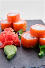 Close up view of rolls with salmon isolated on white