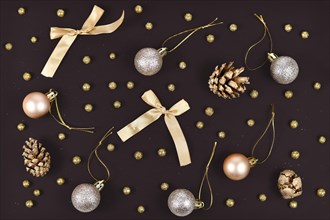 Elegant Christmas flat lay with golden tree ornament baubles